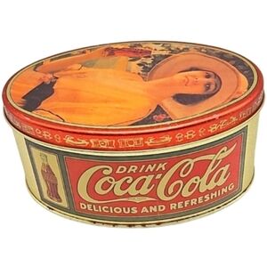 Coca-Cola oval metal tin container 1992